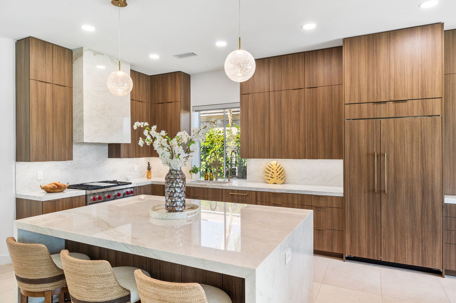Island seating with integrated refrigerator wall and floor-to-ceiling cabinet towers, Rancho Mirage